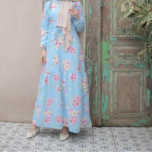 a woman in a long blue dress