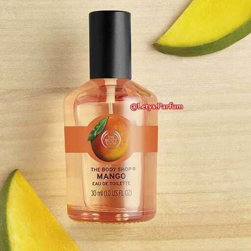 a bottle of perfume on a wooden table