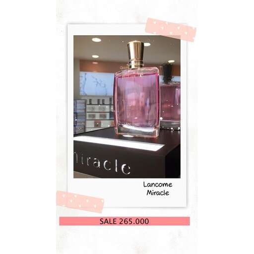 a bottle of perfume on a table in a store.