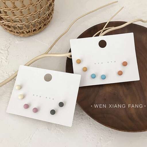 a simple card with a few different colored dots.