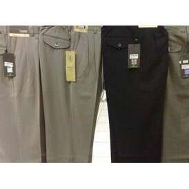 a pair of black pants with a tag attached to them.