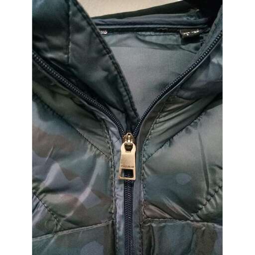 the jacket is a lightweight, heavy - duty jacket with a zipper.