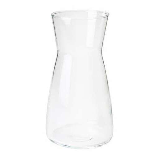 a clear glass vase with a lid.