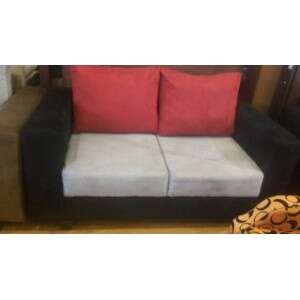 a black and white chair with a white cushion