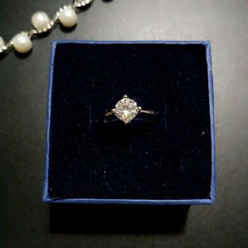 a diamond ring in a box