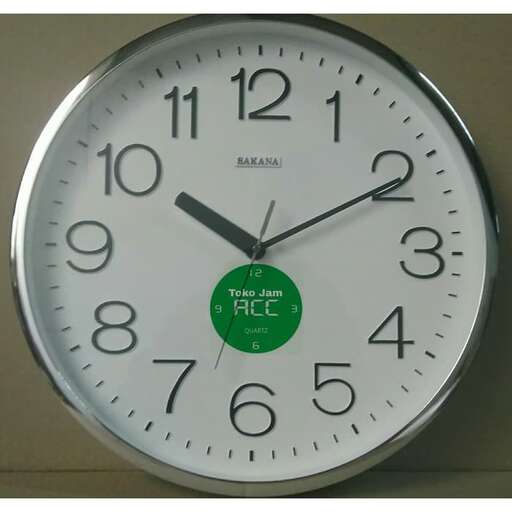 a clock with a green background and a white face.