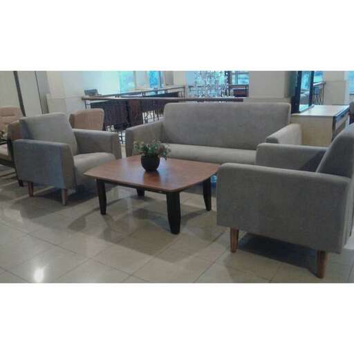 a large room with a lot of couches and chairs.