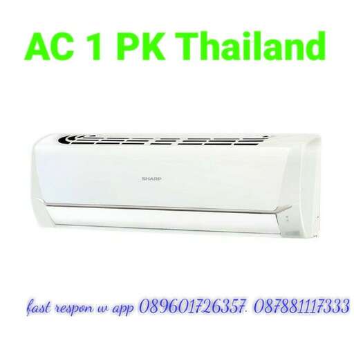 a white electric heater with a black top.