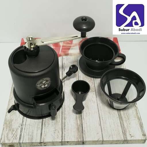 a set of black kettles and a cup of hot water.
