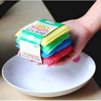 a hand holding a stack of colorful paper towels.