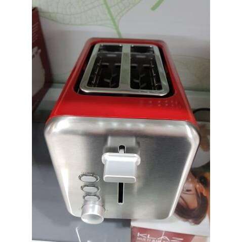 a red and silver appliance on display.