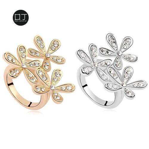 a pair of earrings with a floral pattern.
