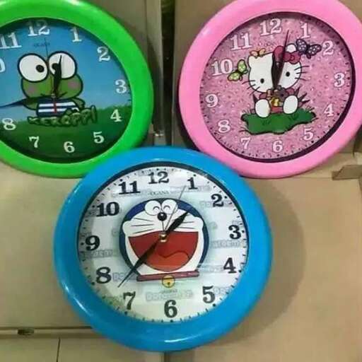 a wall clock with a cartoon cat and a cat clock.