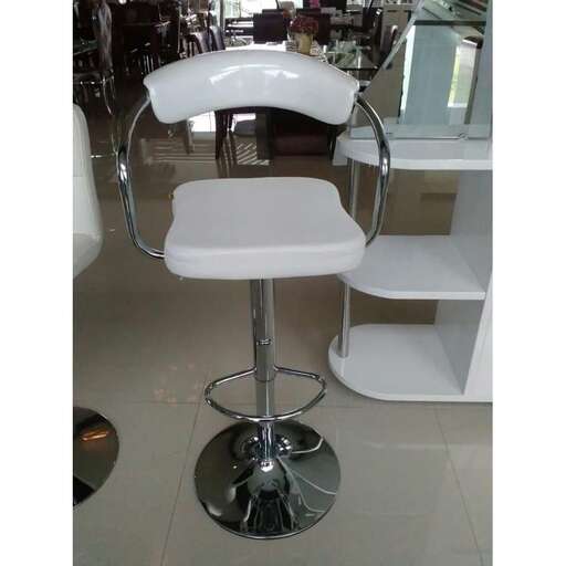 a white chair sitting in a bathroom next to a mirror.