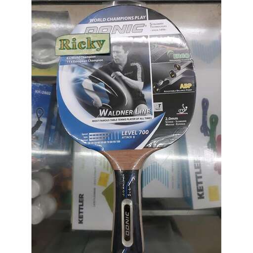 a racket with a picture of a person holding a tennis racket.
