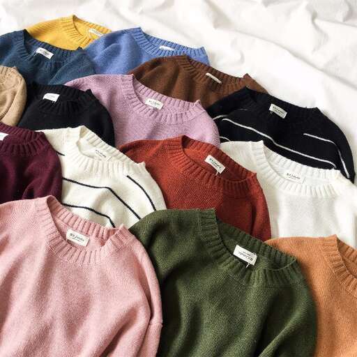 a selection of sweaters in a window display