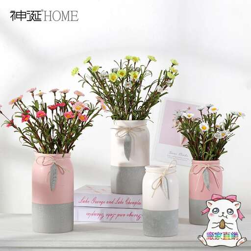 three vases with flowers in them are sitting on a table.