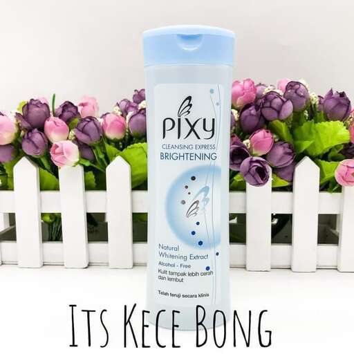 a bottle of shampoo on a white picket fence.