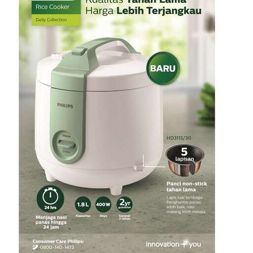 a white electric mixer with a green lid.