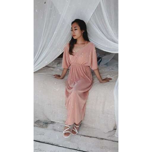 the dress is made of silk and is available in sizes.