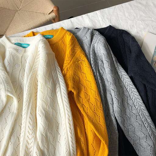 a pile of clothes on a bed