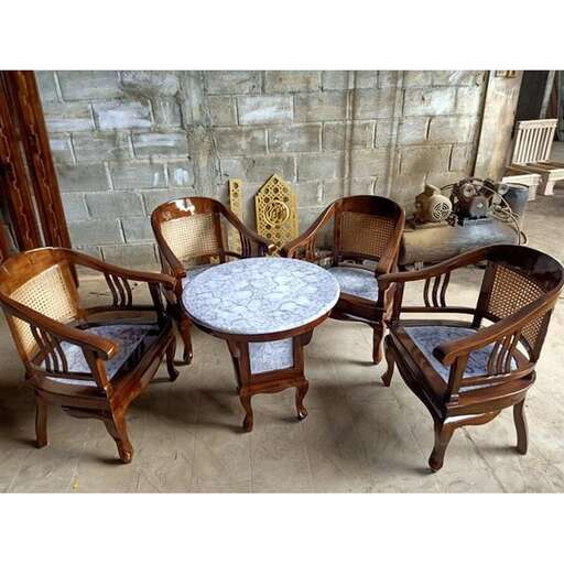 a dining table and chairs set up in a room.