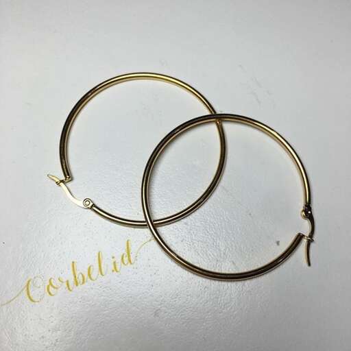 a pair of gold hoop earrings.