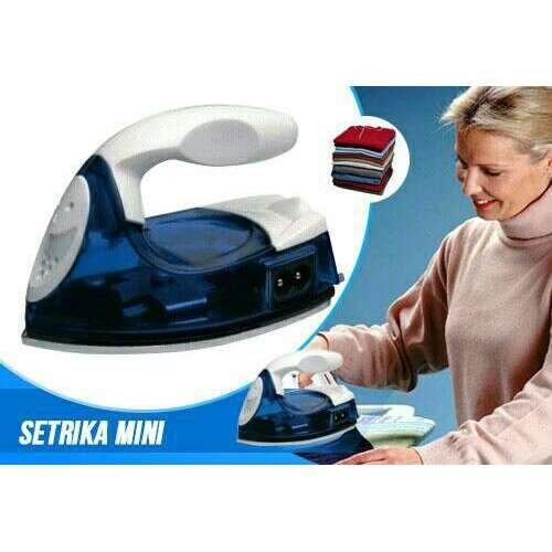 a woman is holding a blue toaster.