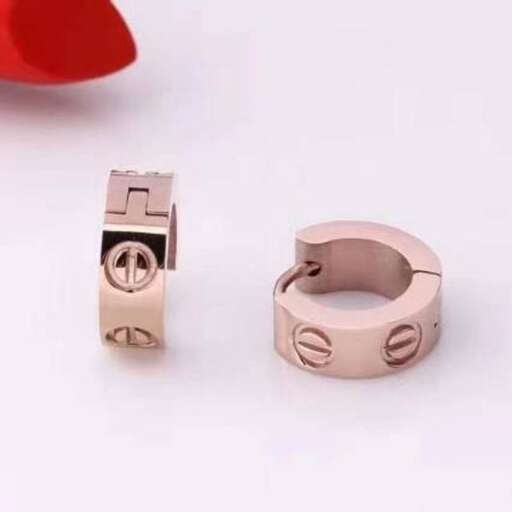 a ring with a heart shaped top and a small heart on the other side.