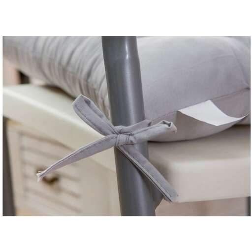 a ribbon tied to a bed frame.