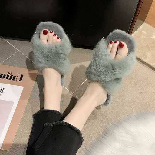 a pair of woman's feet with red nail polish on them.