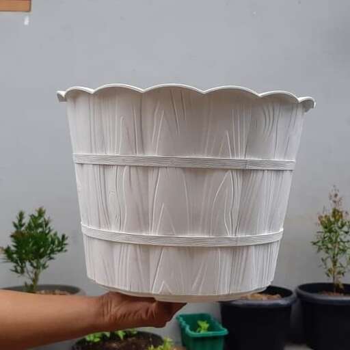 the planter is made from a recycled plastic container.