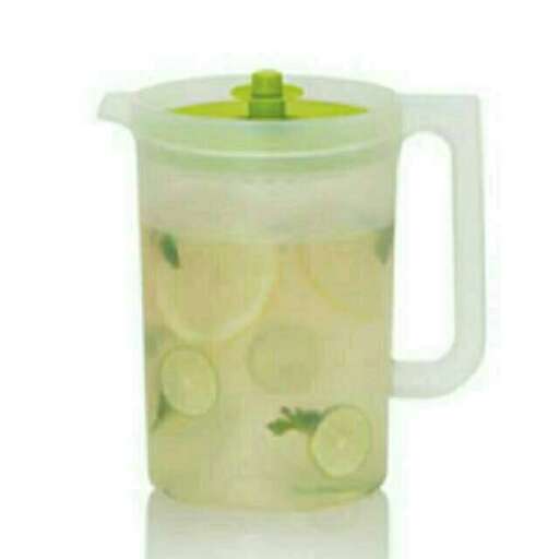 a pitcher of lemonade with a green lid.