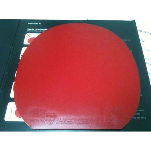 a red cake with a red circle on it.