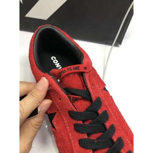a pair of red canvas shoes