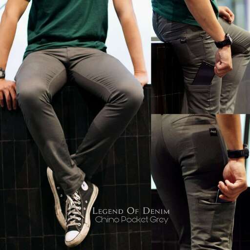 a man with a green shirt and grey jeans
