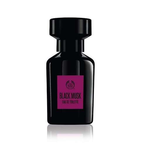 black perfume bottle with pink label on the side