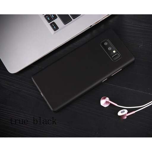 a black smartphone with a pink headphones on it.