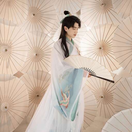 a woman in a white dress holding a umbrella.