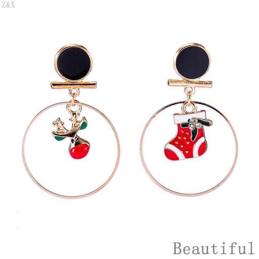 a pair of earrings with a red apple and a bell.