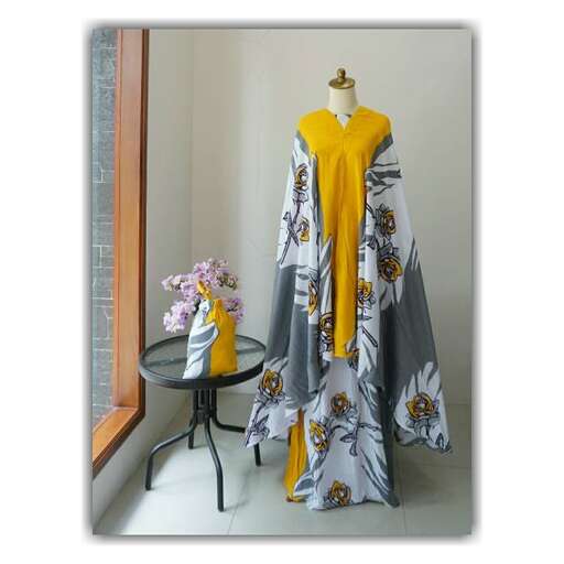 a yellow and gray dress with a black and white floral print.