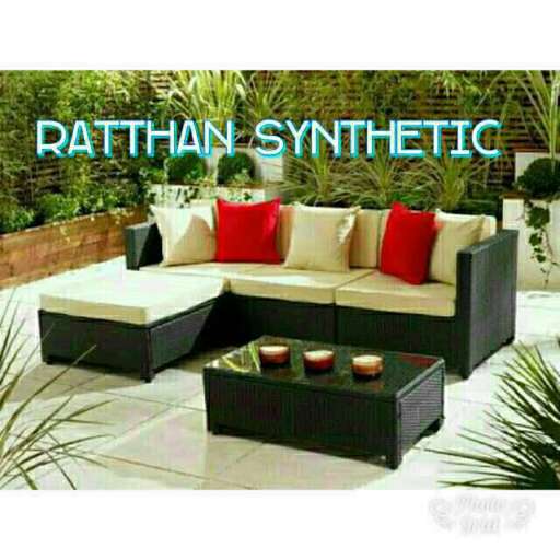 a modern patio with a large outdoor sofa.