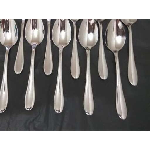 a collection of spoons and spoons on a wall.