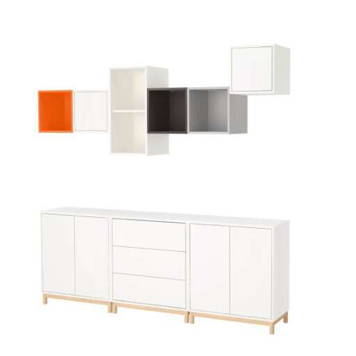 a modern white dresser with orange and grey accents.