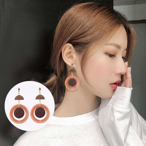 a woman with earrings and earrings