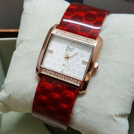 a watch with a red face.