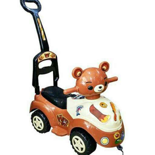 a toy car with a teddy bear on it.