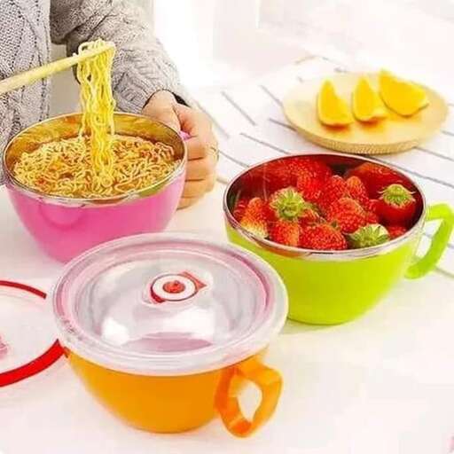 a woman is eating strawberries and oranges on a table.