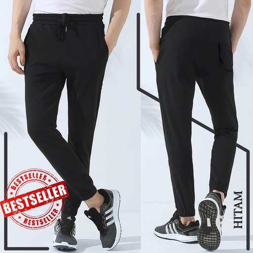 a pair of black trousers with a white t - shirt and black shoes.
