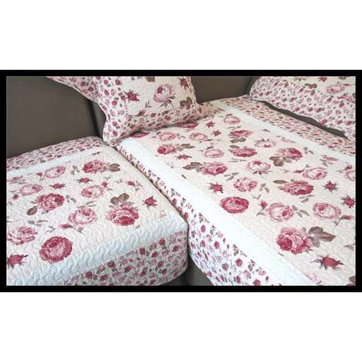 a bed with a floral design.
